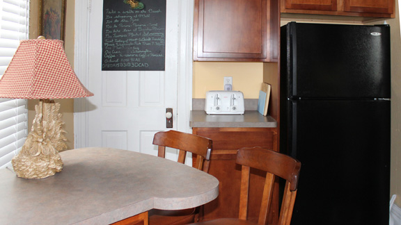 Little breakfast bar tucked in at end of kitchen